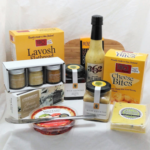 Cheese lover gift with a selection of cheeses, small shopping board, condiments, cheese pairing honeys, 180 Degrees lavosh and cheese bites and cheese knife